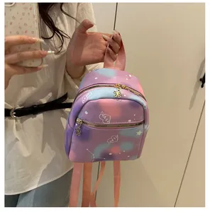 Detail of mini starry backpack with gold flower zippers and love heart pattern