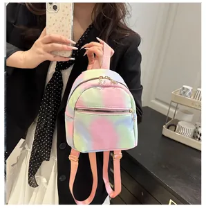 Detail of mini tie-dye backpack with golden flower zipper and macaron rainbow tones