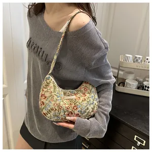 Detail of floral hobo shoulder bag showing premium jacquard texture and vintage floral pattern