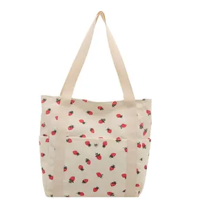 Large capacity beige corduroy tote bag with red strawberry print and front snap pocket