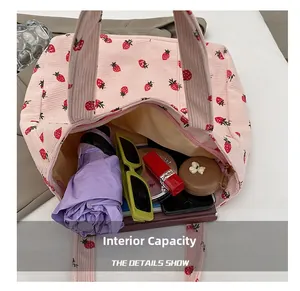 Pink corduroy tote bag showing internal capacity for umbrella, phone, and sunglasses