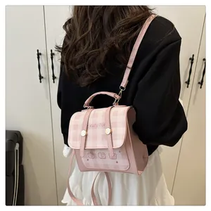 Pink and white checkered mini backpack with cute bear motifs and golden hardware accents