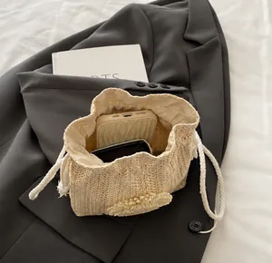 Top view of woven bucket bag showing internal capacity for phone and wallet