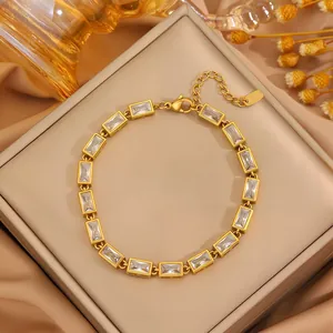 Gold plated stainless steel tennis bracelet featuring rectangular clear zircon stones