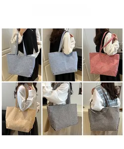 Detail showcasing six colors of plaid canvas tote bags with woven texture for daily use
