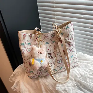 Chic white square tote bag with cartoon print, gold pearl chain and plush charm