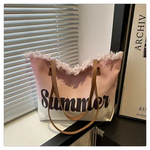 Close-up of pink gradient canvas tote bag with Summer print and frayed edge detail