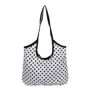 Large capacity black and white polka dot tote bag with black shoulder straps for daily commute