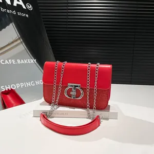 Chic red sequined shoulder bag with metallic CD clasp and elegant silver chain strap