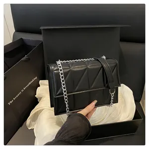 Quilted black flap shoulder bag with silver chain strap and matching gift box set