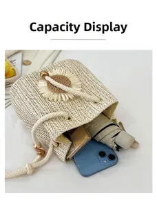 Capacity display of straw bucket bag with flower showing phone, umbrella and wallet