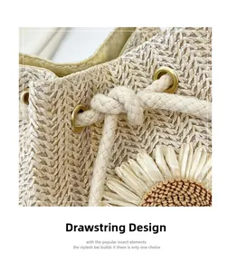 Macro view of woven straw bucket bag showing drawstring design and sunflower detail