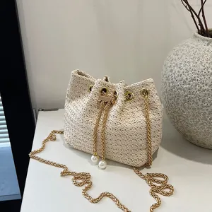 Fashion Straw Woven Bucket Bag For Women Gold Chain Drawstring Crossbody Beach Bag With Artificial Pearl Decoration Summer Shoulder Bag