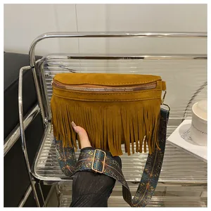 Brown fringe crossbody bag for women, retro suede shoulder handbag with wide ethnic strap.