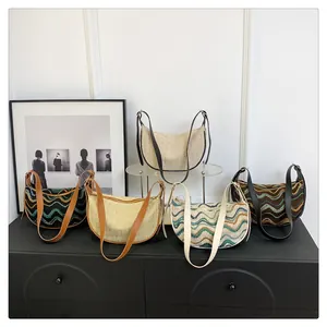 Detailed collection of woven crescent shoulder bags in various colors and striped patterns