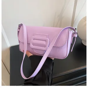 Close-up of the light purple faux leather shoulder bag with a stylish square buckle