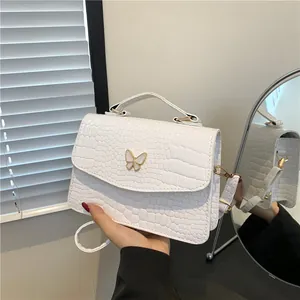 White crocodile pattern shoulder bag with a gold-edged butterfly metal ornament