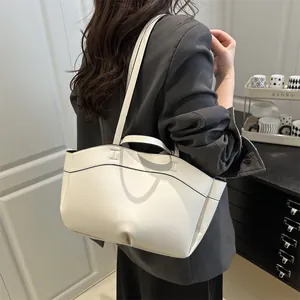 Minimalist off-white large tote bag with H-stitch detail and curved top edge design