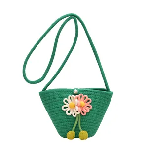 Handmade green woven cotton rope beach bag with floral decor and pearl buckle