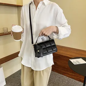 Chic black quilted crossbody bag with matching mini pouch and leather strap for women