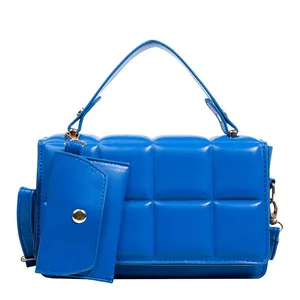 Royal blue quilted PU leather handbag for women featuring a matching mini pouch charm