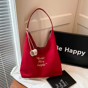 Red large capacity canvas tote bag with leather straps and artistic lettering design