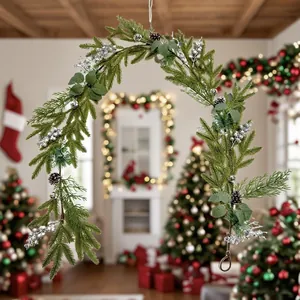 Detail of Christmas wreath with pine needles, cones, and silver berries for festive decor