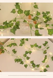 Detail of warm white LED lights woven into realistic artificial green ivy vine leaves