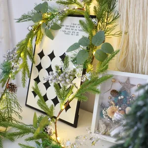 Christmas pine needle garland with silver berries, bells, cones and LED fairy lights