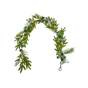Elegant Christmas pine garland with silver berries and pinecones on a white background