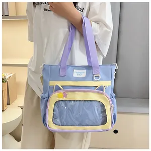 Close-up of tricolor tote bag featuring cat ear design and a clear window pocket