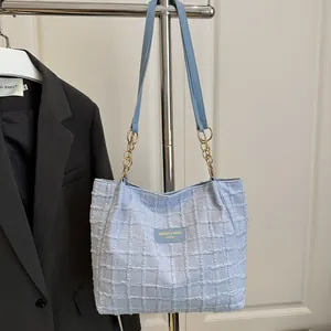 Large light blue tweed tote bag with gold chain strap for women, 2025 fashion commute style