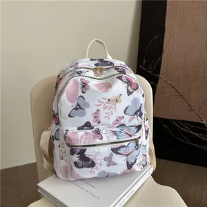 Women's white floral backpack with colorful butterfly print and adjustable straps
