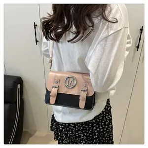 Chic color-block cross-body bag for women with stylish metal M logo and double buckle straps.