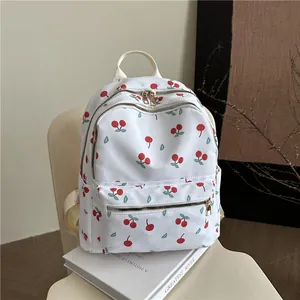 Floral cherry print school backpack with large capacity and gold zippers for women