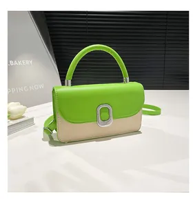 Detail of neon green leather and beige woven texture on crossbody bag with silver buckle