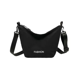 Large capacity black crescent crossbody bag with white FASHION lettering and nylon texture