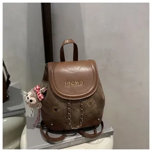 Vintage canvas backpack with leather flap, IBCMB embroidery and plush bear charm