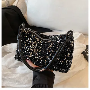Detailed view of the black sequined handbag texture with premium zipper closure