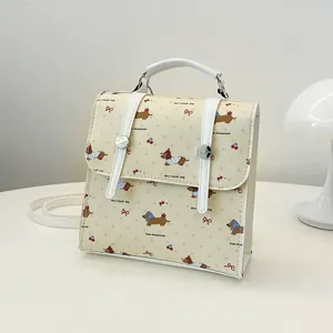 Mini cream backpack with dachshund print, square flap, and silver stud decorations