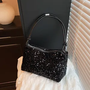 Chic black sequin baguette shoulder bag with leather strap and silver hardware accents