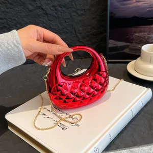 Red metallic diamond quilted half-moon clutch bag with top handle and gold chain strap