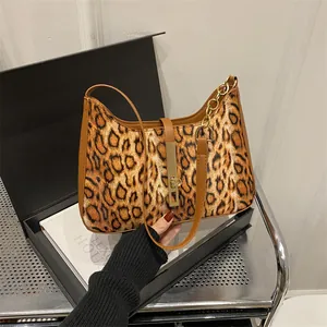 Chic leopard print underarm bag for women with golden buckle and leather strap