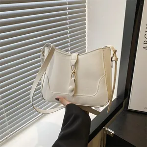 Minimalist white PU leather shoulder bag with gold infinity buckle and adjustable strap