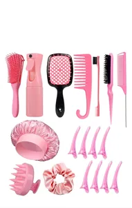 Pink hair care set featuring massage brushes, spray bottle, sleep cap, and clips