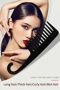 Macro view of a black wide-tooth comb with hook handle for wet hair styling
