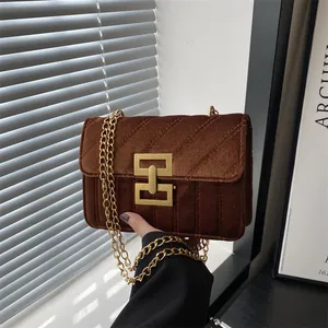 Retro brown velvet crossbody bag with gold chain strap and geometric metal lock