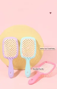 Detail view of colorful hollow-out hair combs with a honeycomb structure for fast drying