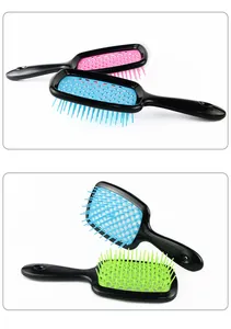 Detail of pink, blue and green honeycomb vented hair brushes with ergonomic handles