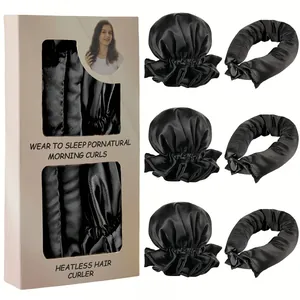 Detailliertes Set schwarzer hitzefreier Lockenwickler mit rosa Geschenkverpackung